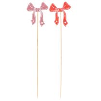kohteita Koristeelliset rusettikukkapellitikut 32 cm 12 kpl