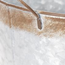 kohteita Kukkaruukku kahvoilla, koristeellinen kulho ruosteenvärisellä pinnalla, hopeanvärinen metalliastia Ø26cm, korkeus 25.5cm