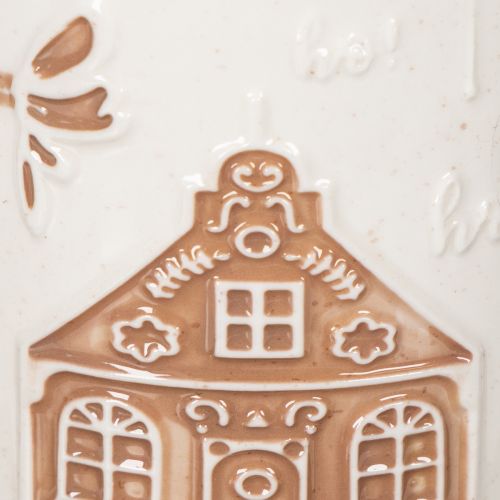 Keraaminen muki taloaiheella