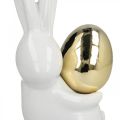 Floristik24 Tyylikäs pääsiäispupu, keraaminen pupu kultaisella munalla, pääsiäiskoristeet valkoinen, kultainen H18cm 2kpl